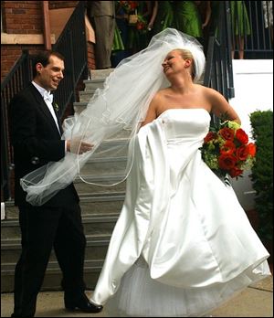 BREEZY BRIDE: Michael Butkovic and Julie Schadek wed on July 4th. Sparks flew at the reception, as well as over the city skies.