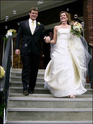 BUBBLING OVER: Jean-Baptiste LeBoutillier and Nicole Frechette exit Zoar Lutheran Church as husband and wife.