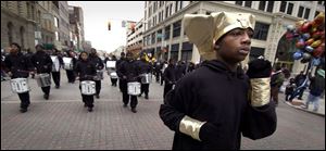 Drum major Jyrell Gresham, 16, leads the Mecca Temple Egyptian Knights Drum and Drill Corps during the parade.