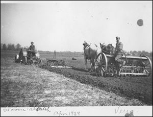 A tractor, left, pulls a plow, disc, and harrow in April, 1938, through a field at Creek Bend Farm in Sandusky County while a horse-drawn planter follows. The farm, along both banks of Muddy Creek, will become the county's newest park.