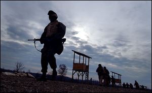 Members of the 983rd Engineer Battalion, Headquarters Company, which is based in Monclova Township, leave the live firing range.