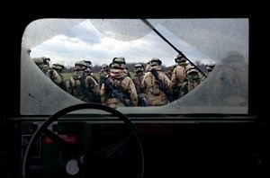 Soldiers with the Southfield, Mich.-based B Company of the 983rd Engineer Battalion receive their after-action report at Camp Atterbury Joint Maneuver Training Center in Edinburgh, Ind.