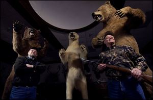 Twins Larry, left, and Gary Clymer, 66, display in Columbus Grove 102 exotic animals bagged on hunting trips and safaris.