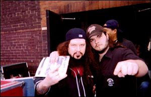 Josh Miller of Toledo, right, got a chance to meet his music idol, 'Dimebag' Darrell Abbott, left last year in Detroit.