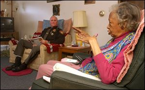 Special Deputy Bill Dickerson visits periodically with Lima resident Lady Alice Hurd during an 'Are You OK' visit.