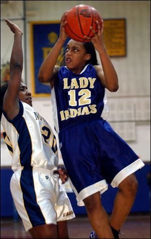 Shareese Ulis, who led Waite with 11 points, shoots over Patrice Lalor, who paced Notre Dame with 10.