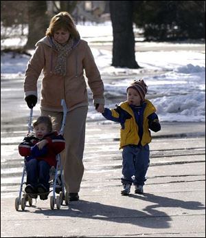 CTY  rove  Wildwood Preserve Metropark.  l-r  Carol Stewart , Toledo, takes her grandson Matthew Stewart 3(in stroller), Maumee, and his friend Austin Witty 3, for a walk Wednesday.  They go somewhere different once a week for what she calls 