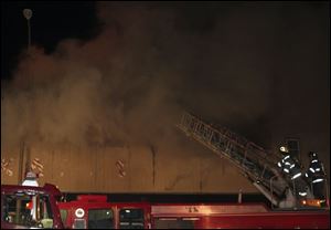 Smoke pours from the building on South Avenue before the flames break through.