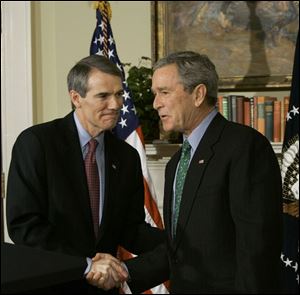 President Bush announces in the White House that Ohio Rep. Rob Portman, left, a Republican, loyal supporter, and friend, is his choice to be the new trade representative.