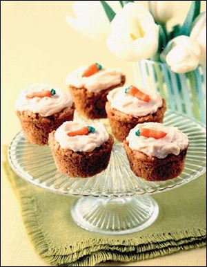 Hippity Hop Cupcakes combine the popular flavor of carrot cake with a hint of peanut butter. Top them with icing and frosting carrots. 