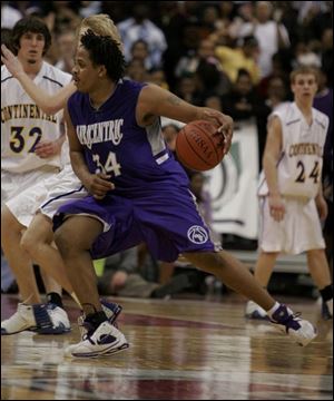 LaQuawn Perry of Columbus Africentric drives on Continental players in the Div. IV state semifinals.
