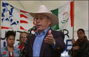 Baldemar Velasquez speaks during a rally at Golden Rule Park after the march.
