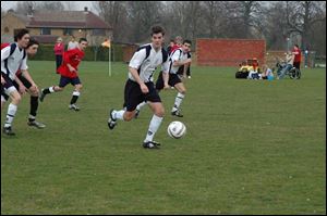 Michael Langdon of St. John s controls the ball in a match against Bassingbourn Village College
during the Greater Toledo Futbol Club s trip to England.