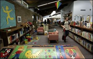 Edward Wallace, 13, makes use of the Pemberville Library, which needs to expand its space on East Front Street and make improvements to two branches in Luckey and Stony Ridge.