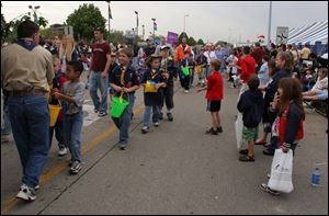 CTY oregfest22p 2 .jpg  Despite threatening skies and rain hundres of people lined Dustin road for the grand parade during the Oregon Festival in Oregon, OH 05/22/2005 The Blade/Lisa Dutton