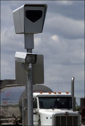 The traffic enforcement camera at Wales and Oregon roads in Northwood is activated and ready to capture an image as soon as a vehicle violates the speed limit or runs a red light.