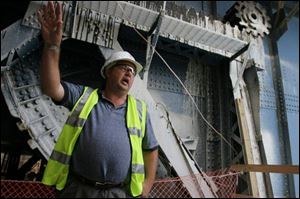 Two stories below street level, project manager Jeff Kracun explains renovations under way and already completed. Work will culminate in March with the addition to two new draw spans.