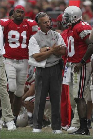 Ohio State coach Jim Tressel gives some advice to quarterback Troy Smith.
