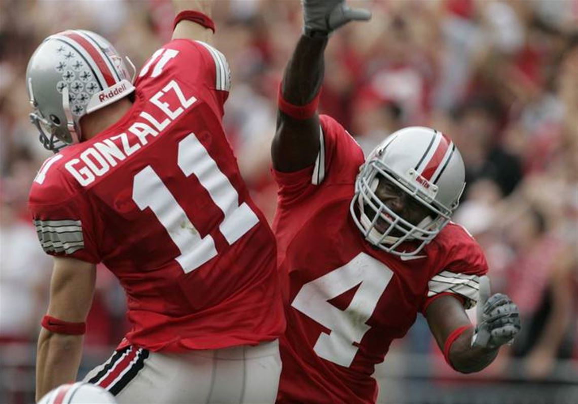 Ohio State linebacker A.J. Hawk (47) celebrates with teammate