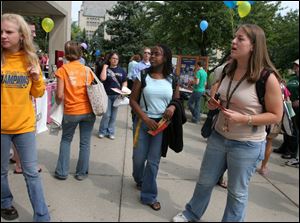 Ashley Moncrief, center, and friend Lauren Brett, right at the UT Club Fair.