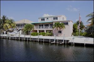 In 2002, Tom Noe wrote a check for $43,773 to landscape this waterfront home in Islamorada, Fla. The attorney general says Mr. Noe forged the check to allow him access to funds to pay for the landscaping.