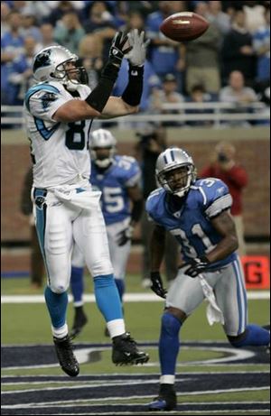 Detroit's R.W. McQuarters can only watch as Ricky Proehl hauls in the game-winning, three-yard TD pass from Chris Weinke.