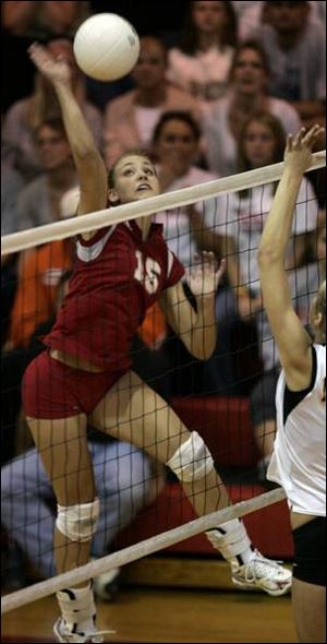 Katie Stoots spikes one for Bowling Green, which defended its Northern Lakes League title with a win over Northview.