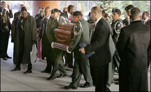 The casket of Rosa Parks is moved into the Greater Grace Temple in Detroit for the seven-hour funeral service.