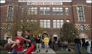 Students leave school at Port Clinton Middle School. Voters are being asked to approve funds for new classrooms.
