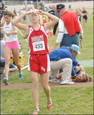 Bowling Green High School's exhausted Christy Titus crosses finish line at Scioto Downs struggling to stay on her feet.