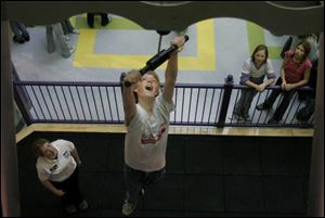 Matt Mossing, 13, of St. Joan of Arc School hits the top of the BOYO. That's about 13 feet off the ground. 