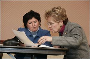 Lucas County Commissioner Tina Skeldon Wozniak, left, and U.S. Rep. Marcy Kaptur question elections spending.