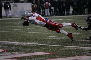 Drew Kuesel looks like a Patriot missile as he launches himself into the end zone Friday.