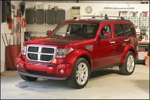 Tom LaSorda, president and CEO of Chrysler, says the Dodge Nitro, to be produced in Toledo, is 'going to be a big hit. It's going to be a great, great vehicle.'