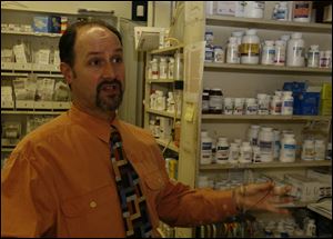 Michael Calabrese, pharmacist and owner of Erie Drugs in North Toledo, said the new Medicare program has been a nightmare. Others affected by the program's changes feel the same way.