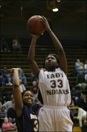 Waite's Tatyana McNeal takes the ball to the basket in front of Notre Dame's Jamie Poston.