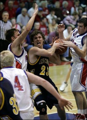 Archbold's Josh Johnson has the ball stripped by Patrick Henry's Brian Yarnell, right, as he drives against Kyle Brubaker.