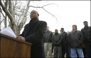 Phil Copeland announces his candidacy for Lucas County commissioner in front of the Albertus Brown Apartments, where he grew up. The Toledo city councilman, who was elected in October, told supporters he 'knows the struggle' of having to depend on social services and would bring to the county commissioners 'life experience that no one in that office has.''