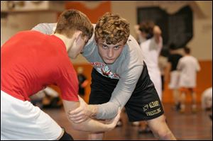 Marc Hoff, right, practices against teammate Steve Carnahan. Hoff owns the Liberty Center record for career victories with a 156-16 mark including a 29-2 record this season. He has placed third at the state meet in the 145-pound class for two straight seasons.
