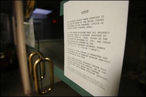 A Treasury Department blocking notice is posted on the door to KindHearts' West Toledo office in the Westgate Building.