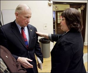 Mayor Carty Finkbeiner, who has urged Toledo Public Schools to keep Eugene Sanders on board as superintendent, greets board President Darlene Fisher before a special meeting.