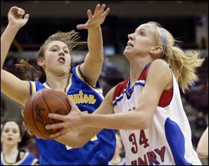 Patrick Henry's Alison Meyer goes up for a shot against East Canton's Karris Kandel. Meyer had 14 points and 10 rebounds.