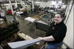 Frank Ozanski obtained a $5,000 loan to expand his sign-making company in downtown Toledo.