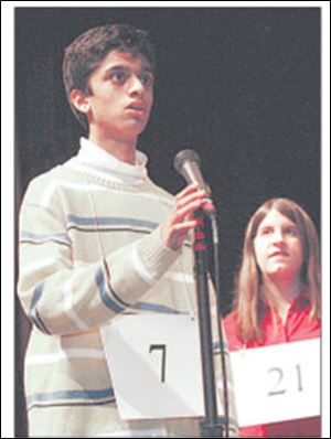 Nirbhay Jain, left, a student at Ottawa Hills Junior High School, correctly spells  semainier  on his way to winning last night s Blade Northwest Ohio Championship Spelling Bee. The runner-up was Ashley Chapman, right, of St. Aloysius School in Bowling Green. She misspelled the French-based word for a tall, seven-drawer chest.  
