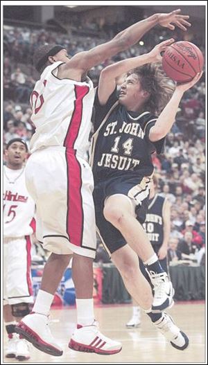 St. John's guard Joe Jakubowski drives against top-ranked Canton McKinley's Morgan Williams last night in a Division I state semifinal game at Value City Arena.