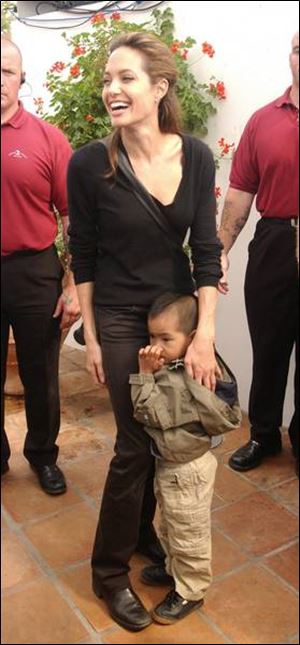 Maddox and Angelina Jolie attended a concert in England last summer.
