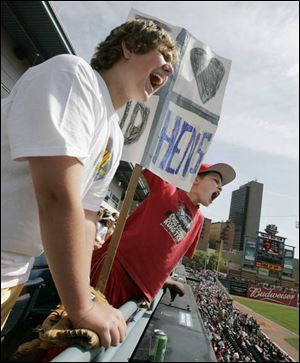 Austin Speck and Tad Eynon, sixth-graders at Eastwood Middle School, cheer the Mud Hens during a 1-0 win over the Buffalo Bisons at Fifth Third Field. 