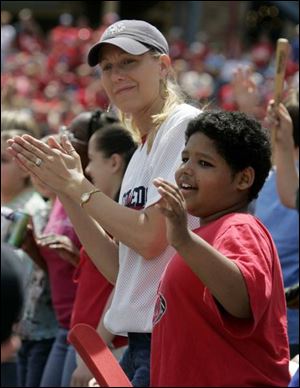 Yesterday s game, which brought out, Marshall Elementary teacher Lisa Frisinger and student Anthony
Bunts, 11, was the year s last  School Day.  