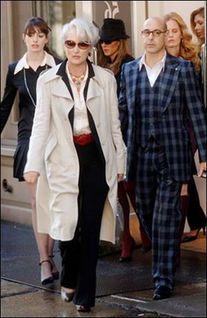 Miranda Priestly (Meryl Streep)
with two of her assistants, Andy
(Anne Hathaway), left, and Nigel
(Stanley Tucci) in The Devil
Wears Prada.