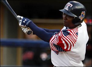 Mud Hens outfielder Tike Redman tracks his fly ball in the fifth inning last night at Fifth Third Field. Redman was 0-for-2.